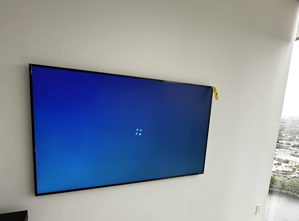 Samsung Frame TV mounted flush with a view of Lady Bird Lake