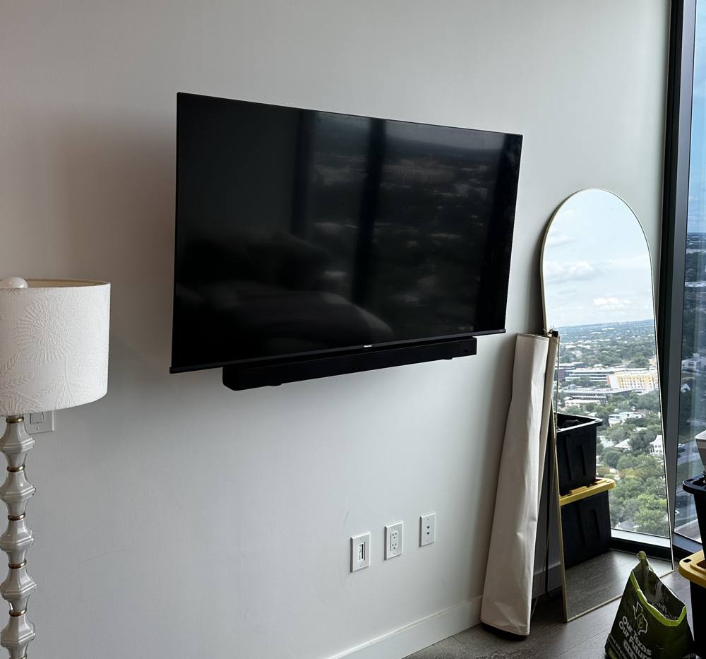 Hisense TV with soundbar mounted below